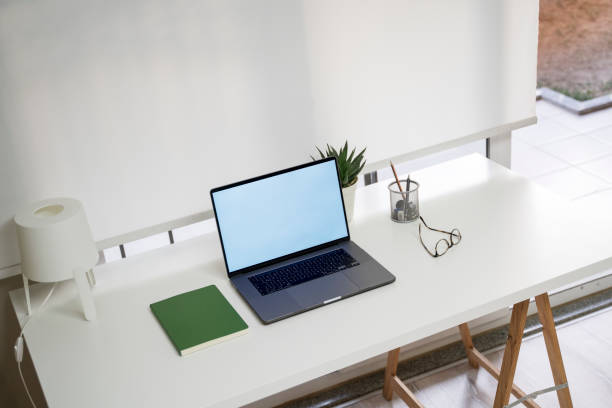 istock Home office with computer desk in living room, daylight shot 1315630613