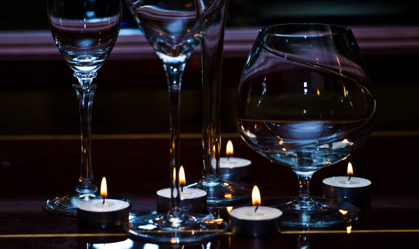 istock White Round Candles and Wine Glasses 1315635780