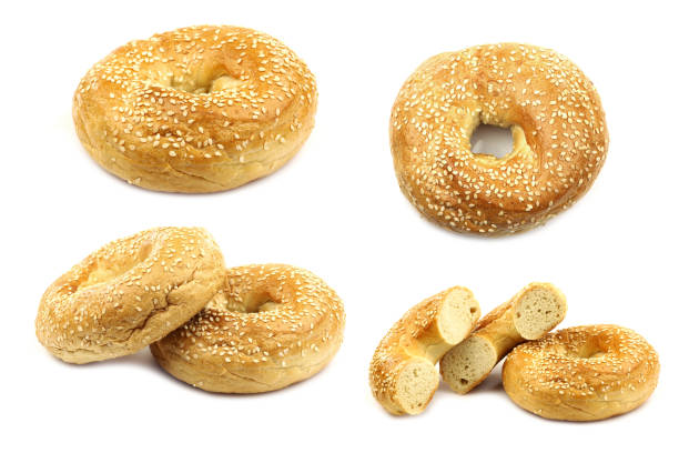 freshly baked bagels freshly baked bagels on a white background sesame bagel stock pictures, royalty-free photos & images
