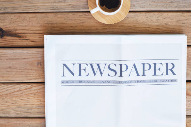 istock Newspaper with coffee on the table 1315639301