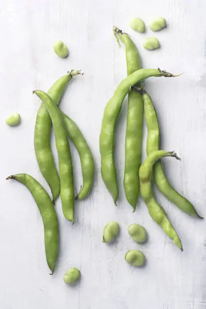 Broad bean or  fava beans  or Fave, Rustic food cooking and healthy eating springtime background. From garden to table: springtime vegetables, ingredients of Mediterranean cuisine