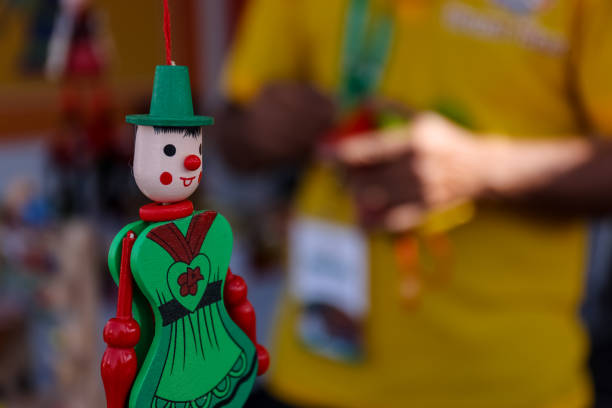 istock Wooden handmade colorful puppet on display 1315642875