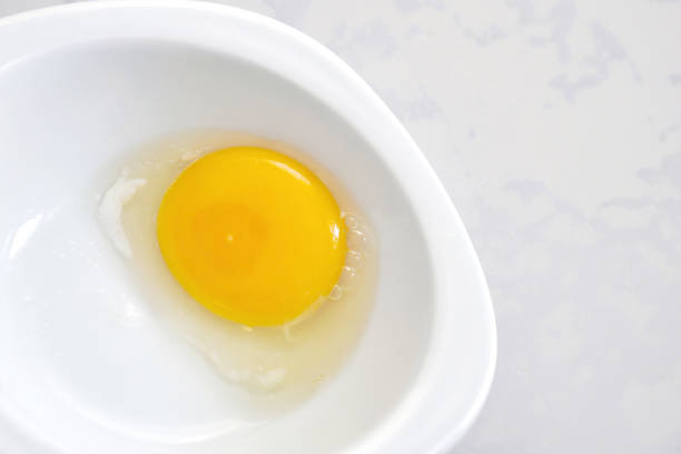 istock egg white and yolk in the plate separated from the shell, 1315643852