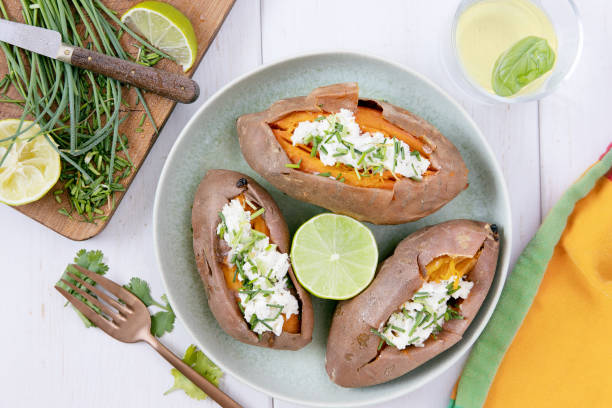 istock Sweet potatoes with sour cream, chive, onions, lime 1315646509