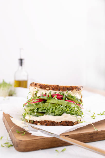 istock Veggie Sandwich with cream cheese, salad, radish 1315646723