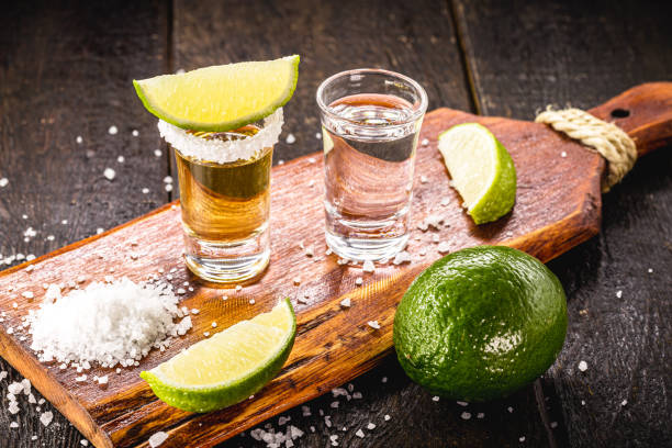 glasses of tequila, gold tequila and silver tequila, typical mexican drink - tequila shot imagens e fotografias de stock