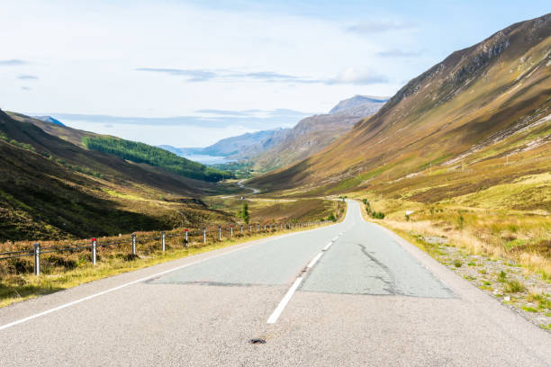 istock A832 road running through Glen Docherty in Scotland 1315664130