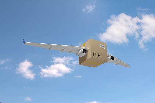 Cardboard box with airplane wings on a blue sky background. Shipping concept. 3d illustration.