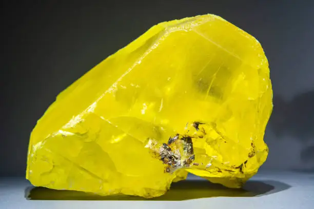 Yellow solid crystal of sulfur (octasulfur S8).