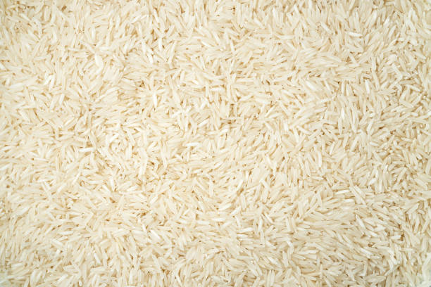 istock White long basmati rice textured background. Gluten free food. 1315676165
