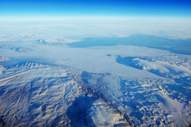 istock Flying over snow covered land 1315676942