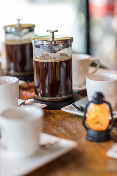 istock French Press Coffee Maker. Morning concept. coffee siphon. Spent coffee break at the organic cafe and prepare Chocolate or tea in French press. 1315681694