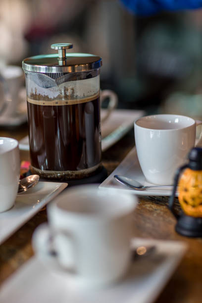 istock French Press Coffee Maker. Morning concept. coffee siphon. Spent coffee break at the organic cafe and prepare Chocolate or tea in French press. 1315681787
