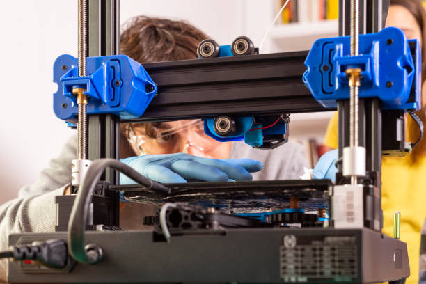Modern 3D printer printing figure close-up stock photo