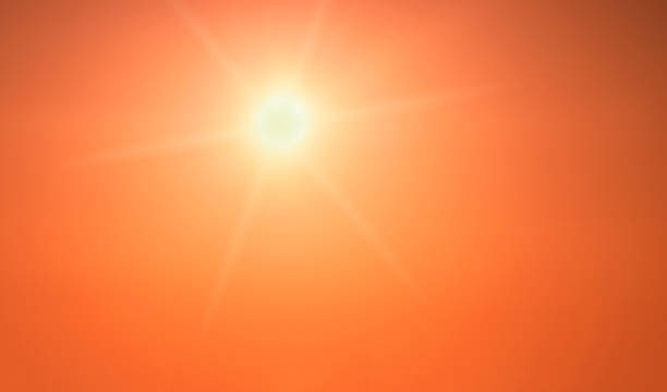 istock The sun shining brightly in a clear orange sky 1315684459