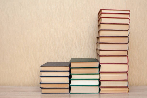 istock Stack of books on the table on a neutral background 1315692693