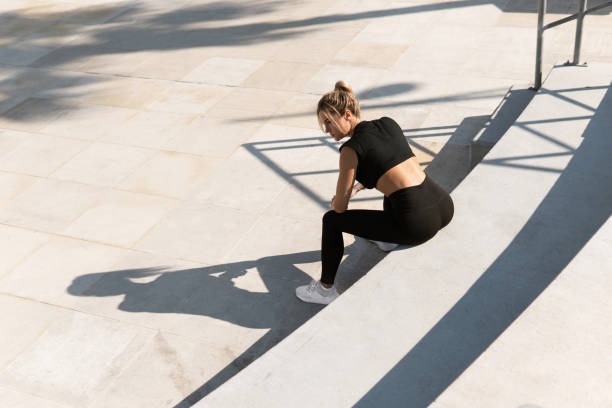 istock Young athletic woman and her shadow during summer workout 1315693360