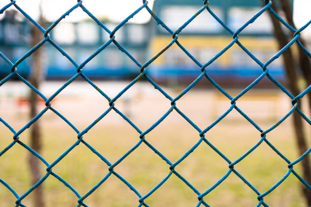 istock chain-link of blue color close-up, background is blured 1315696241