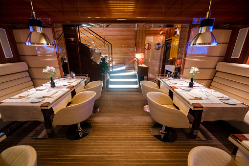 Commercial space and architecture of a luxury restaurant designed like a yacht.