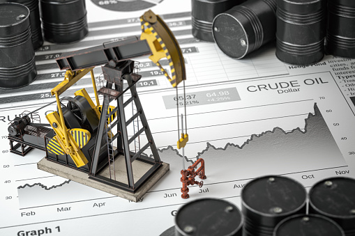 Oil pump jack and barrels on newpaper with growth of price of crude oil. Stock market of crude oil, investment and petroleum industry.  3d illustraton