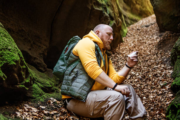 istock Hiker man using an asthma inhaler outdoors on a european staycation 1315703846