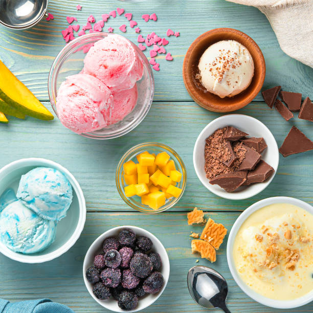 istock Cream, raspberry, blackberry and mango ice cream on a light blue background 1315705539