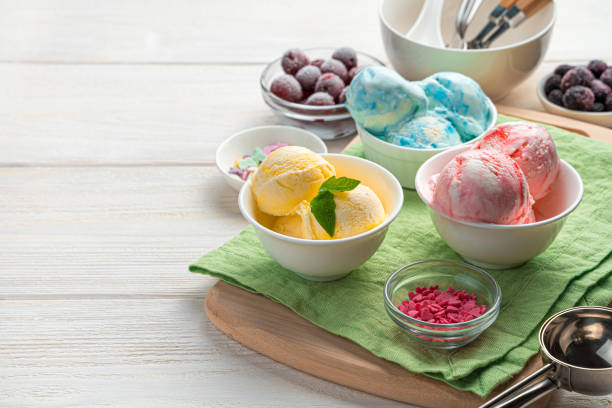 istock Three types of ice cream in white cups on a light background 1315707114