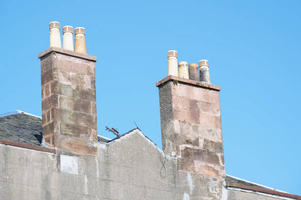 istock Chimney pots on old victorian house roof 1315707344