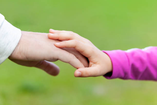 istock Father and daughter shaking hands 1315708650