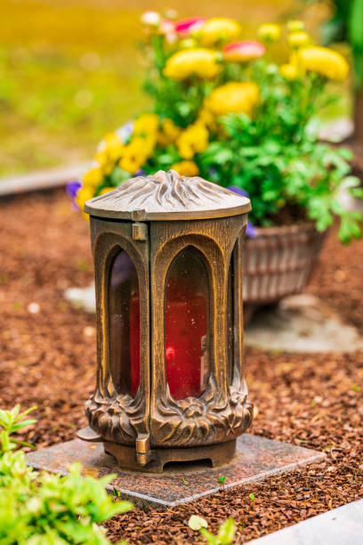 istock damaged grave light with  candle on a grave 1315708997