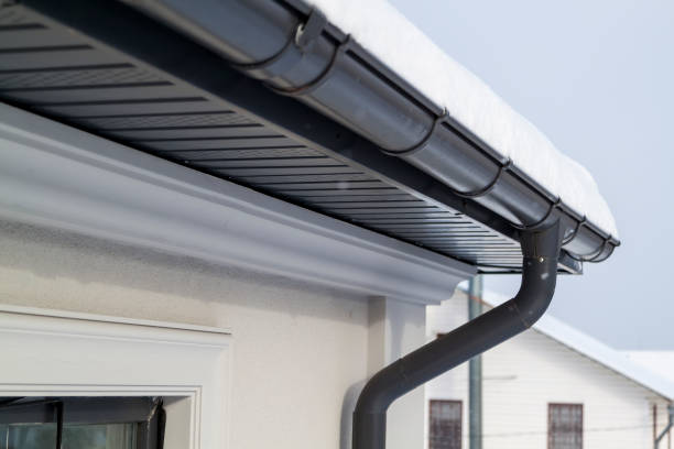 corner of the house with new gray metal tile roof and rain gutter at winter. metallic guttering system, guttering and drainage pipe exterior - eavestrough imagens e fotografias de stock