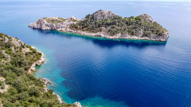 istock A small green island with clear sky and blue sea 1315716052