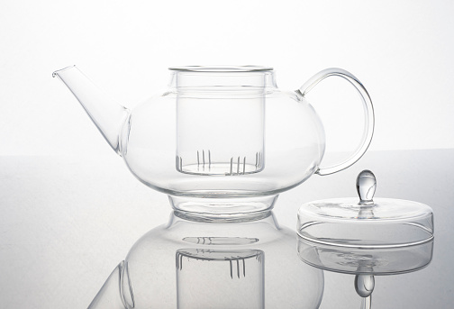 Glass teapot on a white background