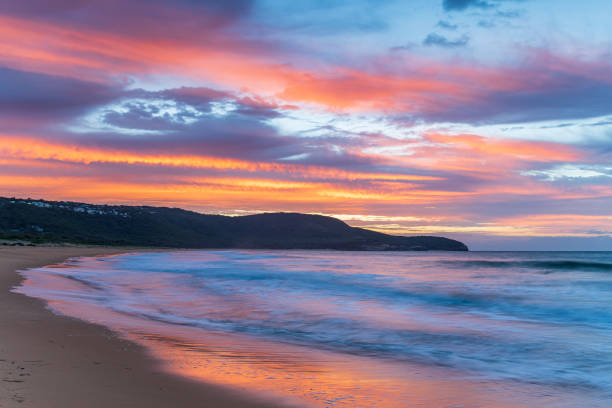 istock Sunrise at the seaside with pastel coloured clouds 1315730338