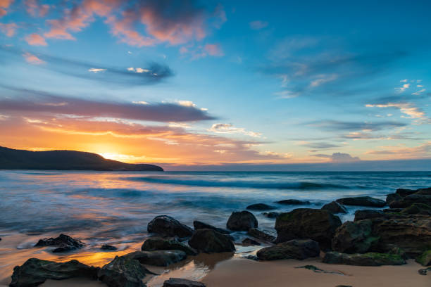 istock Sunrise at the seaside with pastel coloured clouds 1315730488