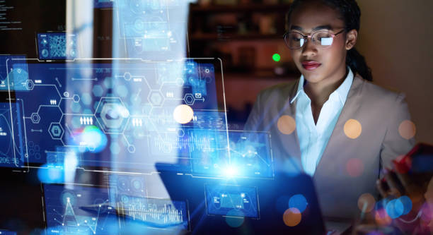 Young woman working in the night office. System engineering. Digital transformation. Young woman working in the night office. System engineering. Digital transformation. dx stock pictures, royalty-free photos & images