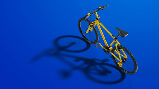 istock Yellow Bicycle Isolated on Blue Background 1315753995