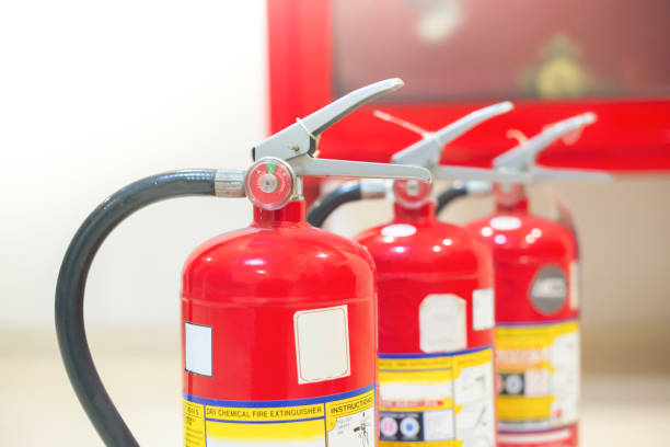 istock Red fire extinguishers available in fire emergencies,safety concept. 1315755259