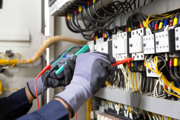 istock Electrician engineer tests electrical installations and wires on relay protection system. Adjustment of scheme of automation and control of electrical equipment. 1315756138