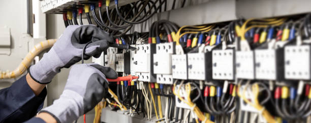 istock Electrician engineer tests electrical installations and wires on relay protection system. Adjustment of scheme of automation and control of electrical equipment. 1315756166