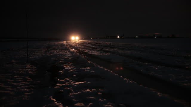 Night, low light, swamp, snow. Retro truck, old soviet military truck world war