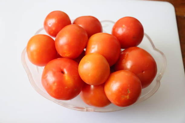 fresh organic tamotoes isolated on white background fresh organic tamotoes isolated on white background tamotoes stock pictures, royalty-free photos & images