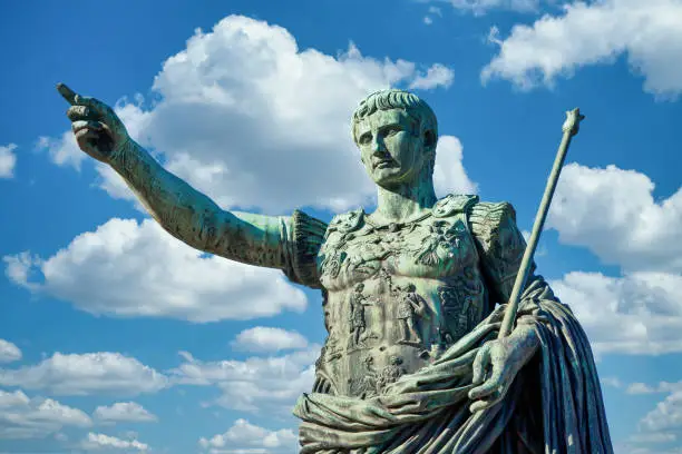 Italy, Rome. Statue in a public street of the roman emperor Gaius Julius Caesar. Concept for authority, domination, leadership and guidance.