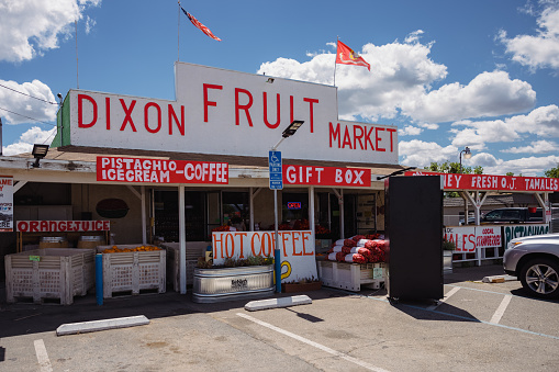 Dixon Fruit Market carries a large selection of local nuts, dried fruits, jams, butters, and olives in addition to fresh seasonal produce.\n\nDixon Fruit Market, Dixon, California at noon