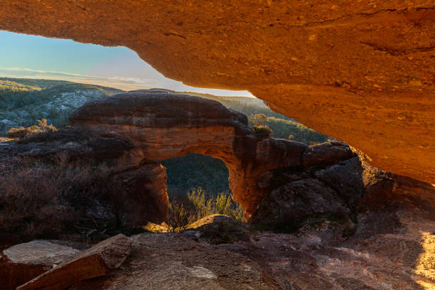 Elephant Arch, unique sandstone formation in Arches National Park Utah under bright sky.