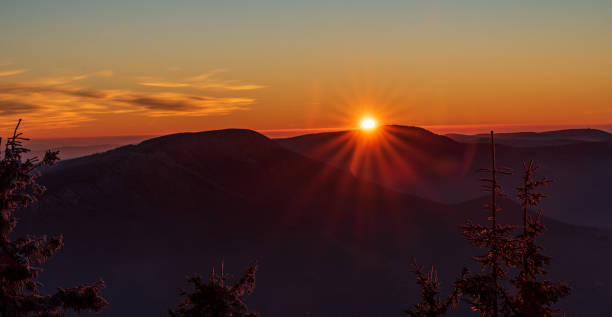 Sunset from Lysa hora hill in Moravskoslezske Beskydy mountains in Czech republic Sunset from Lysa hora hill in Moravskoslezske Beskydy mountains in Czech republic during late autumn day beskid mountains photos stock pictures, royalty-free photos & images
