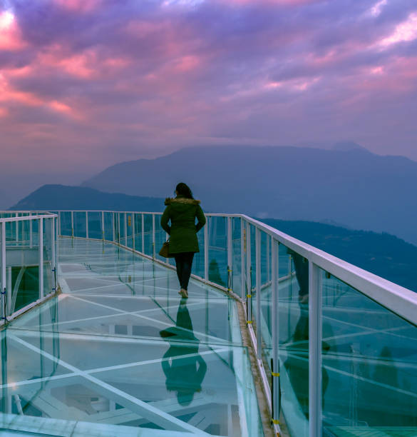 The Chenrezig Shingkham. January 19,2019. A Solo Lady Traveller walking on the Skywalk at The Chenrezig Shingkham project ,coming up as an iconic pilgrimage tourism destination at Sangha Choeling, Pelling.Sikkim. India. buddhist prayer wheel stock pictures, royalty-free photos & images