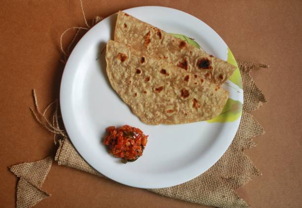 istock Chapati/chapathi with Tomato Curry or chutney served on a plate. 1315794690
