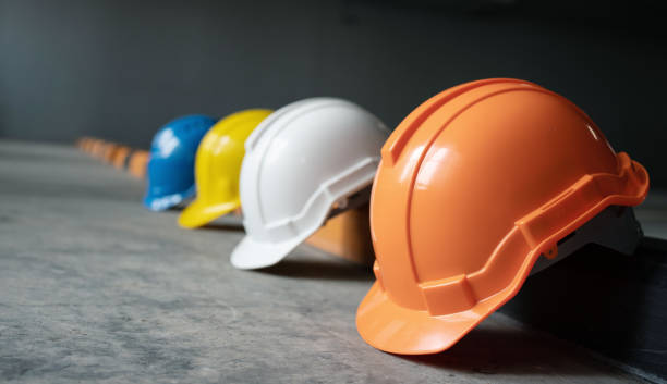 istock Helmet group for safety working in construction plants. Hard hat For safe at work. Teamwork of construction team must have quality. Whether it is engineering, construction workers. 1315795351