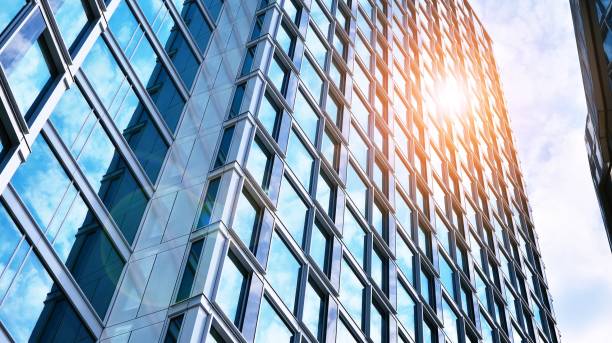 istock Modern office building with glass facade on a clear sky background. 1315796600